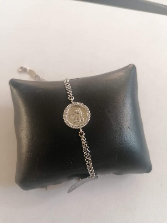 Silver bracelet with cherub medallion